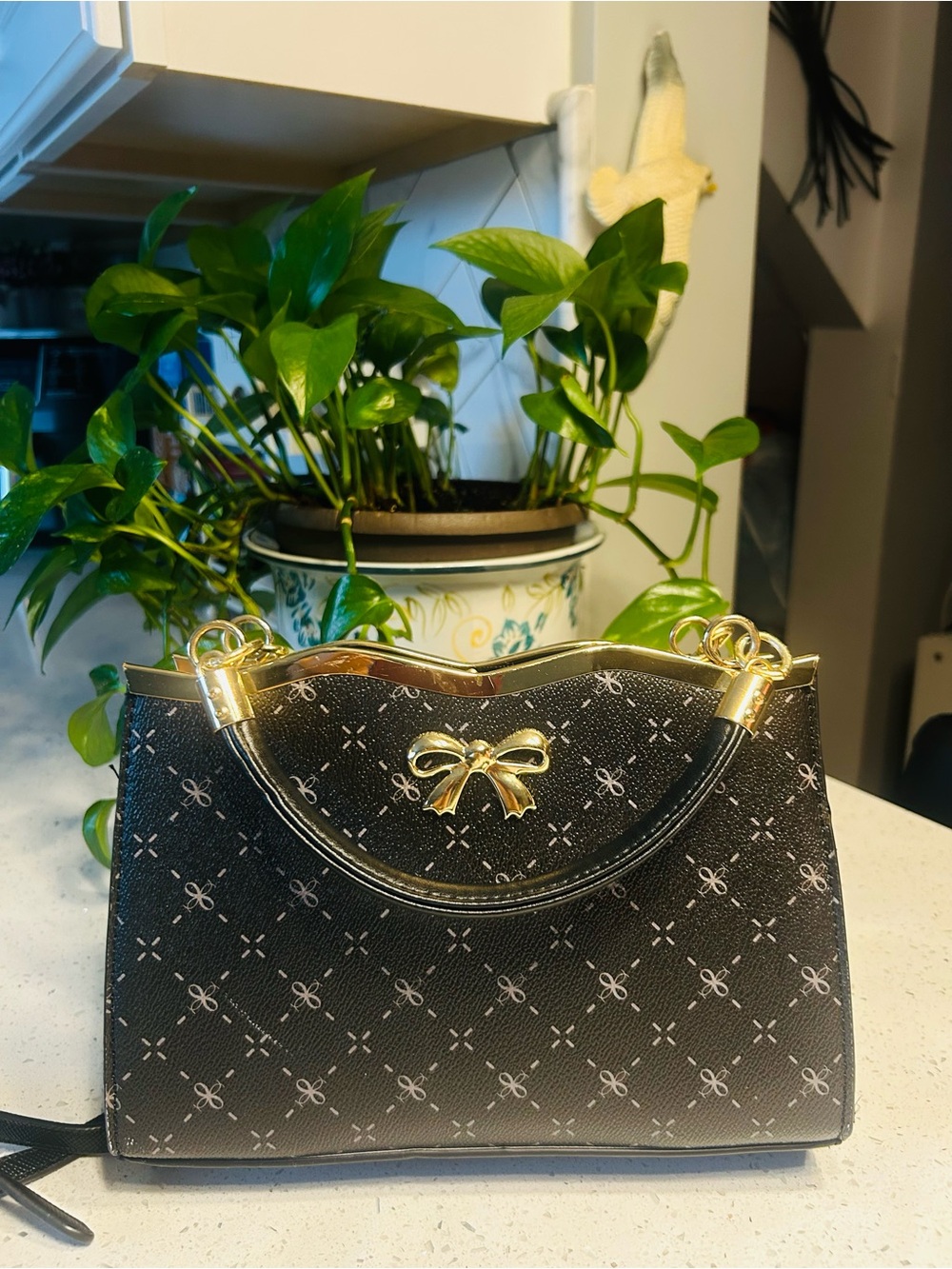 Black Top-Handle Satchel with Gold Bow Accent